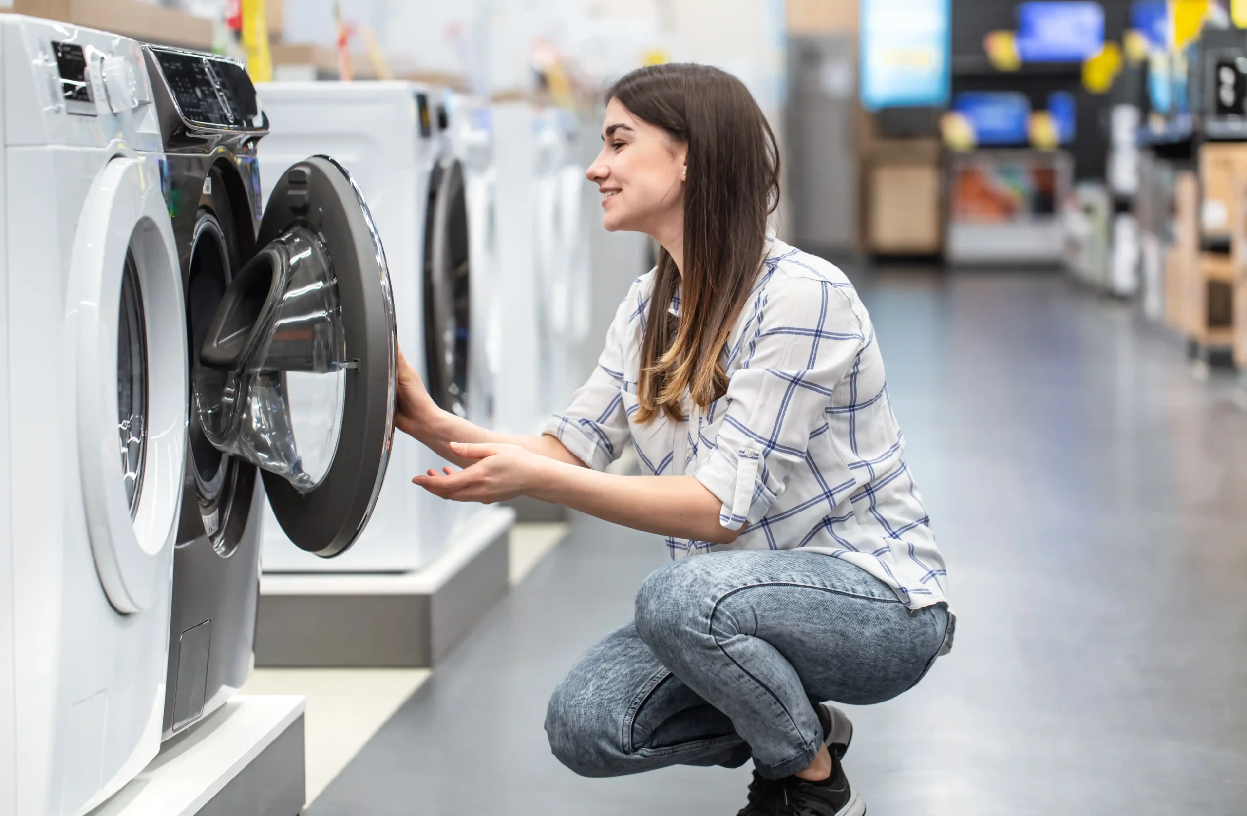 young-woman-store-chooses-washing-machine